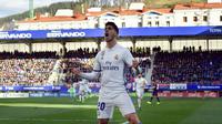 Selebrasi penyerang Real Madrid Marco Asensio usai membobol gawang Eibar. (AP Photo/Alvaro Barrientos)
