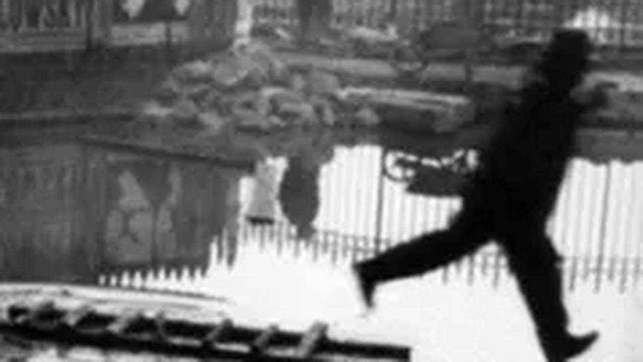 Man Jumping the Puddle – 
Henri Cartier-Bresson, 1932