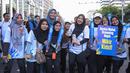Para peserta yang hadir dalam acara fun walk dalam rangka peringatan Hari Kekayaan Intelektual Sedunia 2026 yang berlangsung di Sarinah, Jakarta Pusat pada Minggu (26/4/2026). (Bola.com/Abdul Aziz)