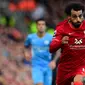 Mohamed Salah. Sayap berusia 29 tahun yang telah memperkuat Liverpool selama 5 musim sejak 2017/2018 ini total telah mencetak 104 gol dari 166 laga di Liga Inggris. Gol teranyar dan yang ke-7 musim ini dicetak saat menang 5-0 atas Watford, 16 Oktober 2021. (AFP/Paul Ellis)