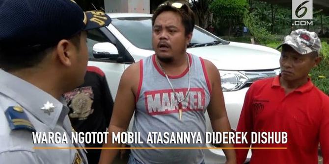 VIDEO: Pekerja Ngotot Saat Mobil Diderek Dishub