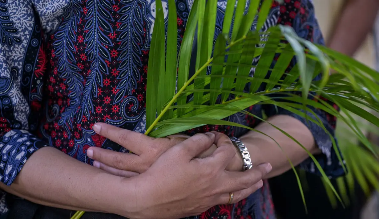 Minggu Palma memiliki makna memiliki yang mendalam bagi umat Katolik dalam memperingati masuknya Yesus ke Yerusalem. (JUNI KRISWANTO/AFP)