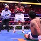 Yordenis Ugas sempat membuat Manny Pacquiao terjatuh saat duel di perebutan gelar WBA, Minggu (22/8/2021) (AFP)