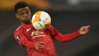 Pemain muda milik Manchester United, Amad Diallo akhirnya berlabuh ke klub Skotlandia, Rangers pada bursa transfer musim dingin 2021/22 dengan status pinjaman. Ia langsung tampil cemerlang di laga debutnya dengan mencetak gol dalam waktu lima menit. (AFP/Oli Scarff)