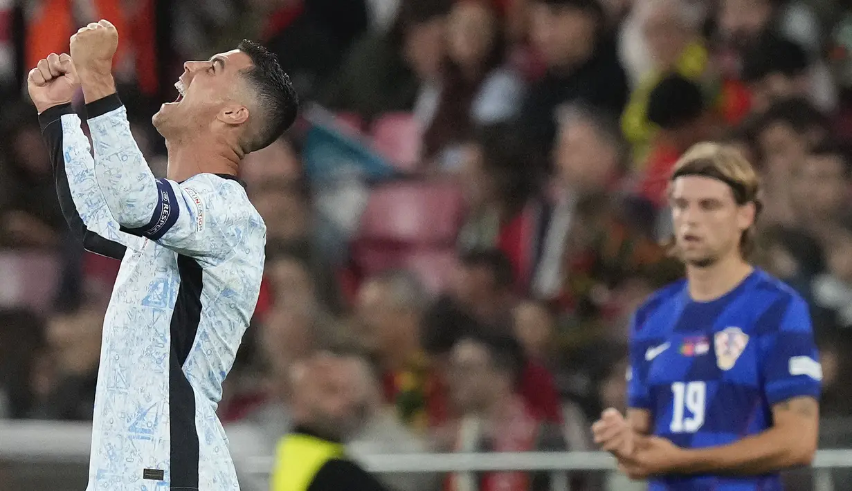 Pemain Portugal, Cristiano Ronaldo tak mampu menutupi rasa bahagianya setelah mencetak gol ke gawang Kroasia pada laga Kualifikasi Piala Dunia 2026 di Luz Stadium, Lisbon, Portugal, Jumat (06/09/2024) dini hari WIB. (AP Photo/Armando Franca)
