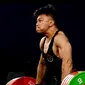 Pada angkatan snatch, Rahmat Abdullah berhasil menorehkan angkatan terbaik 158 kg. (Ishara S.KODIKARA / AFP)