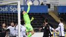 Kiper Swansea City, Freddie Woodman berhasil menjangkau bola dari ancaman pemain Manchester City dalam laga babak kelima Piala FA 2020/21 di Liberty Stadium, Rabu (10/2/2021). Swansea City kalah 1-3 dari Manchester City. (AFP/Rebecca Naden/Pool)