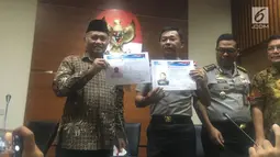 Sketsa pelaku yang diduga penyerang Novel Baswedan ditampilkan pihak KPK dan Polda Metro Jaya, Jumat (24/11). Idham menjelaskan, sketsa tersebut hasil kerja dari tim Australian Federal Police (AFP) dan Pusat Inafis Mabes Polri.(Liputan6.com/Fachrur Rozie)