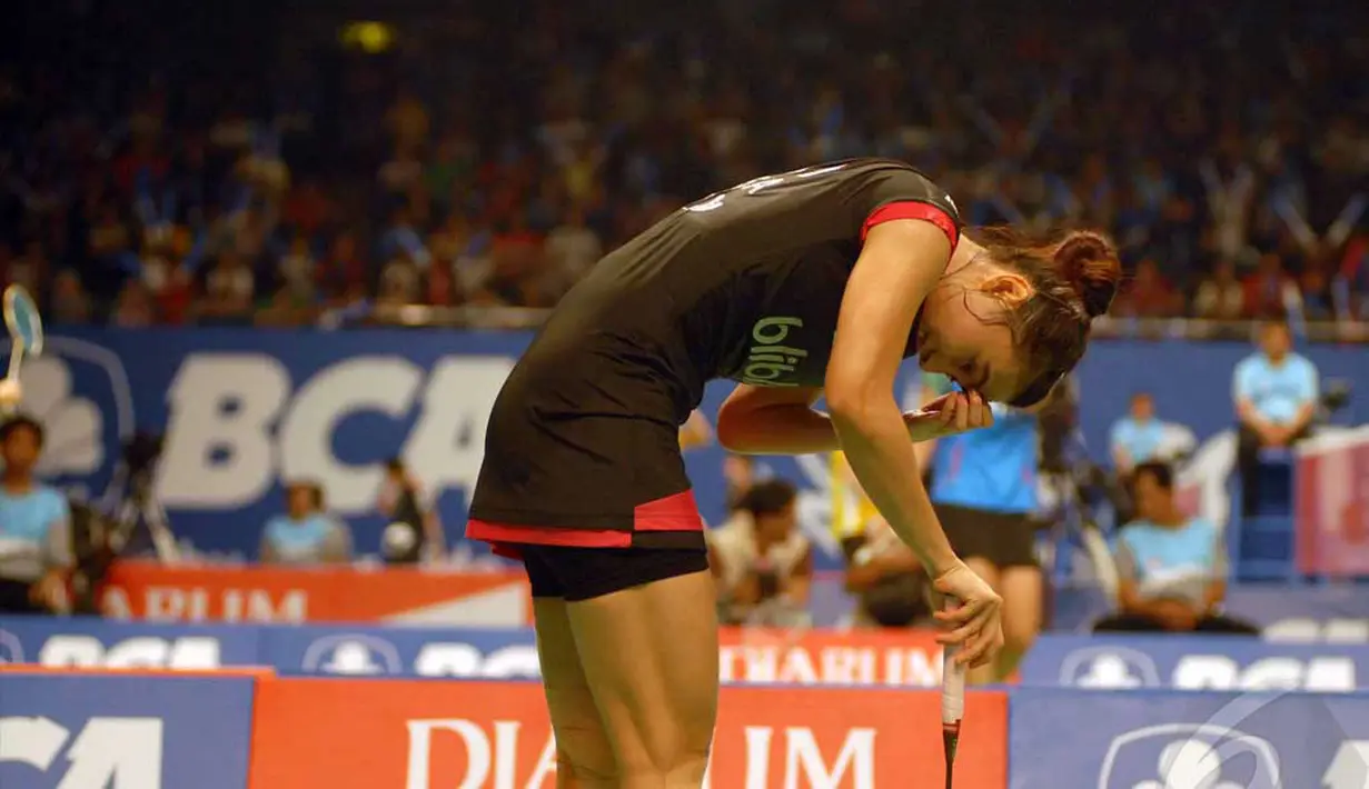 Peraih medali emas SEA Games 2013 di Myanmar itu harus mengakui keunggulan pemain asal Thailand Busanan Ongbumrupan dengan rubber games 21-15, 14-21, 9-21, Jakarta, Rabu (18/6/2014) (Liputan6.com/Miftahul Hayat) 