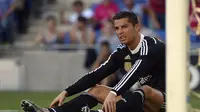 Cristiano Ronaldo tidak bahagia bersama Real Madrid ( AFP PHOTO / LLUIS GENE)