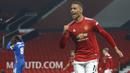 Penyerang Manchester United, Mason Greenwood, melakukan selebrasi usai mencetak gol ke gawang  Brighton and Hove Albion pada laga Liga Inggris di Stadion Old Trafford, Minggu (4/4/2021). MU menang dengan skor 2-1. (Phil Noble/Pool via AP)