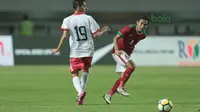 Pemain Timnas Indonesia U-23, Evan Dimas saat melawan Bahrain pada laga PSSI Anniversary Cu 2018 di Stadion Pakansari, Bogor, (26/4/2018). Bahrain menang 1-0. (Bola.com/Nick Hanoatubun)
