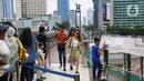 Libur panjang peringatan Isra Mikraj dan perayaan Imlek 2025 dimanfaatkan warga bersama keluarga untuk berlibur ke beberapa destinasi wisata yang ada di kawasan Jakarta. (Liputan6.com/Angga Yuniar)