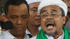 Jaringan Intelektual Muda Anti Fitnah melaporkan pimpinan FPI  Rizieq Shihab ke Polda Metro. terkait pernyataan lambang palu di uang kertas 