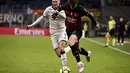 <p>Penyerang AC Milam, Charles De Ketelaere membawa bola dari kawalan pemain Torino, Perr Schuurs pada babak 16 besar Coppa Italia di Stadion San Siro di Milan, Italia, Kamis (12/1/2023). Torino menang tipis atas AC Milan dengan skor 1-0 berkat gol Michel Adopo di perpanjangan waktu. (Marco Alpozzi/LaPresse via AP)</p>