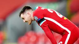 Andrew Robertson - Liverpool lagi-lagi  harus berurusan dengan masalah cedera pemain. Kali ini bek andalannya, Robertson, mengalami cedera engkel saat menjalani laga uji coba melawan Athletic Bilbao. (Foto: AFP/Paul Ellis)