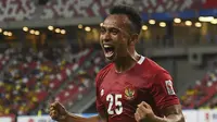 Pemain Timnas Indonesia Irfan Jaya merayakan gol keduanya ke gawang Malaysia pada pertandingan Grup B Piala AFF Suzuki 2020 di National Stadium, Singapura, 19 Desember 2021. (Roslan RAHMAN / AFP)