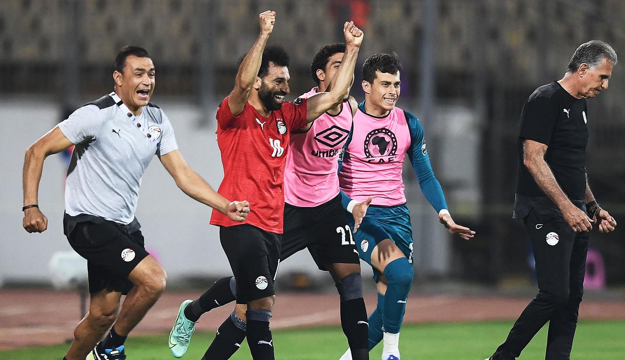 Skor 2-1 bertahan hingga akhir laga. Mesir sukses melaju ke babak semifinal Piala Afrika 2021 dan akan menghadapi Kamerun pada 3 Februari 2022. (AFP/Charly Triballeau)