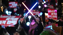 Pada Selasa 10 Desember 2024, pihak berwenang Korea Selatan melarang lebih banyak pejabat tinggi meninggalkan negara tersebut. (Jung Yeon-je/AFP)