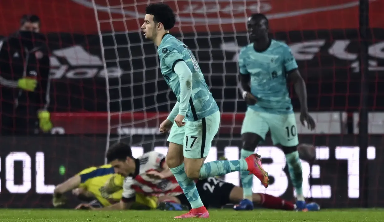 Gelandang Liverpool, Curtis Jones berselebrasi usai mencetak gol ke gawang Sheffield United pada pertandingan lanjutan Liga Inggris di stadion Bramall Lane di Sheffield, Inggris, Senin (1/3/2021). Tambahan tiga poin membuat Liverpool kini mengoleksi 43 poin. (Shaun Botterill, Pool via AP)