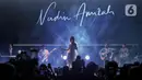 Penyanyi yang juga penulis lagu, Nadin Amizah saat tampil pada hari kedua gelaran KapanLagi Buka Bareng BRI Festival 2025 di Plaza Parkir Timur Gelora Bung Karno, Senayan, Jakarta, Minggu (16/3/2025). (Liputan6.com/Angga Yuniar)