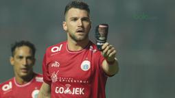 Pemain Persija Jakarta, Marko Simic merayakan golnya ke gawang Persipura Jayapura pada lanjutan Liga 1 Gojek bersama Bukalapak di Stadion Pakansari, Bogor, (25/5/2018).  (Bola.com/Nick Hanoatubun)