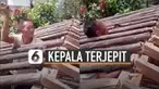 Setelah memasang rangka kayu terakhir, pria ini terjebak.