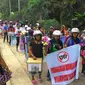 Demo dan pengumpulan koin solidaritas pembunuhan sadis di Bintuni. (Liputan6.com/ Katharina Janur)