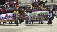 Pawai Ogoh-ogoh di Kabupaten Jayapura. (Liputan6.com/Katharina Janur)