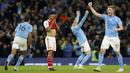 Pemain Manchester City, John Stones, melakukan selebrasi setelah mencetak gol ke gawang Arsenal pada laga Liga Inggris di Stadion Etihad, Kamis (27/4/2023). Gol City dicetak oleh Kevin de Bruyne, John Stones dan Erling Haaland. (Martin Rickett/PA via AP)