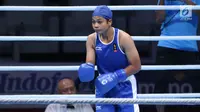 Petinju putri Indonesia, Huswatun Hasanah jelang melawan Sudaporn Seesondee (Thailand) pada semifinal kelas ringan 60kg putri Asian Games 2018 di JIEXPO Kemayoran, Jumat (31/8). Huswatun kalah 0-5. (Liputan6.com/Helmi Fithriansyah)