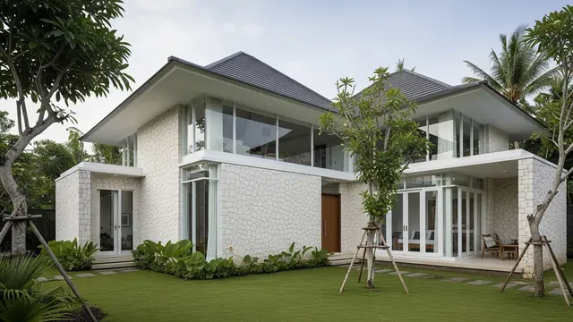 Rumah Kampung Elegan dengan Kombinasi Batu Paras dan Kaca