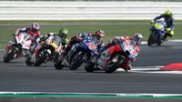 Ilustrasi persaingan di MotoGP 2018. (OLI SCARFF / AFP)
