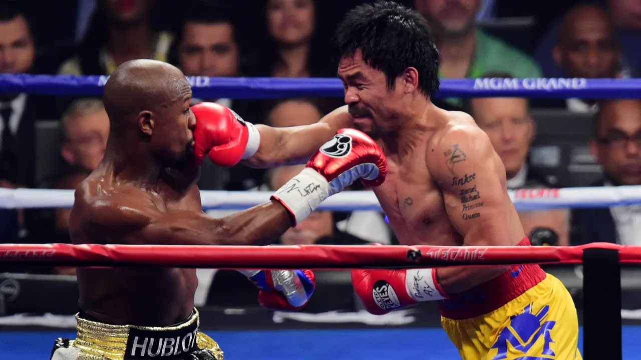 Floyd Mayweather Berhasil Taklukan Manny Pacquiao