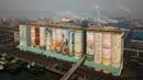 Sebuah mural luar ruangan raksasa yang ditampilkan pada silo gandum di kota pelabuhan Incheon, Seoul, Korea Selatan, Rabu (19/12). Museum Guinness World Records menobatkan karya tersebut sebagai mural luar ruangan terbesar di dunia. (Ed JONES/AFP)
