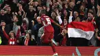 Selebrasi pemain Liverpool, Daniel Sturridge&nbsp;setelah menjebol gawang PSG dalam pertandingan grup C Liga Champions&nbsp;yang berlangsung&nbsp;di Anfield, Selasa&nbsp;(18/9/2018). (Photo by Paul ELLIS / AFP)