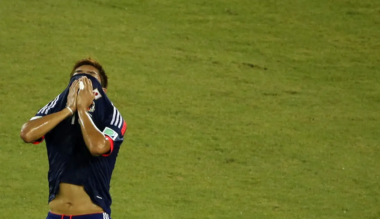 Reaksi pemain Jepang, Yoshito Okubo, usai bermain imbang lawan Yunani di penyisihan Piala Dunia 2014 Grup C di Stadion Dunas, Natal, Brasil, (20/6/2014). (REUTERS/Carlos Barria)