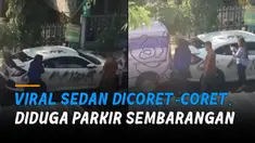 Tidak jelas coretan pesan yang ditulis di berbagai sudut mobil itu.