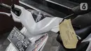 Barang bukti kasus meninggalnya editor Metro TV Yodi Prabowo diperlihatkan di Polda Metro Jaya, Sabtu (25/7/2020). Dari sejumlah fakta yang ditemukan, polisi menyimpulkan editor Metro TV Yodi Prabowo meninggal karena bunuh diri. (Liputan6.com/Johan Tallo)