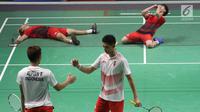 Ganda putra Indonesia, Kevin Sanjaya S/Marcus F Gideon merayakan kemenangan atas Fajar Alfian/M Rian Ardianto di Final Bulutangkis Asian Games 2018 di Istora GBK, Jakarta, Selasa (28/8). Kevin/Marcus unggul 2-1. (Liputan6.com/Helmi Fithriansyah)