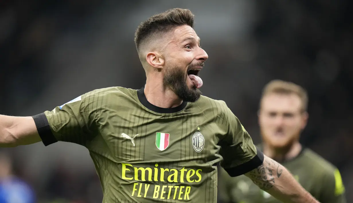 <p>Pemain AC Milan Olivier Giroud merayakan setelah mencetak gol ke gawang Empoli yang kemudian dibatalkan setelah pemeriksaan VAR pada pertandingan sepak bola Serie A Liga Italia di Stadion San Siro, Milan, Italia, Jumat (7/4/2023). AC Milan gagal meraih kemenangan atas Empoli. (AP Photo/Luca Bruno)</p>