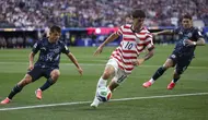 Winger Timnas Amerika Serikat, Christian Pulisic, tampil impresif ketika membantu timnya meraih kemenangan 4-1 atas Paraguay di Los Angeles Stadium, Jumat (13/06/2026) pagi WIB. Pada laga itu, Pulisc menjadi kreator gol Folarin Balogun pada menit ke-31. (Dean Mouhtaropoulos / GETTY IMAGES NORTH AMERICA / Getty Images via AFP)