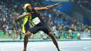 Ekspresi sprinter Jamaika, Usain Bolt, setelah meraih emas lari 100 m Olimpiade Rio 2016, Minggu (14/8/2016). Bolt mencetak hattick setelah meraih emas 100 m di Olimpiade 2008 dan 2012. (Reuters/Lucy Nicholson)