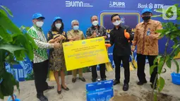 Kegiatan penanaman pohon di kawasan perumahan menggandeng berbagai pihak seperti PLN untuk kompor induksi atau listrik, agar program satu juta kompor induksi dari pemerintah yang merupakan pengalihan dari LPG bisa tercapai. (Liputan6.com/HO/BTN)