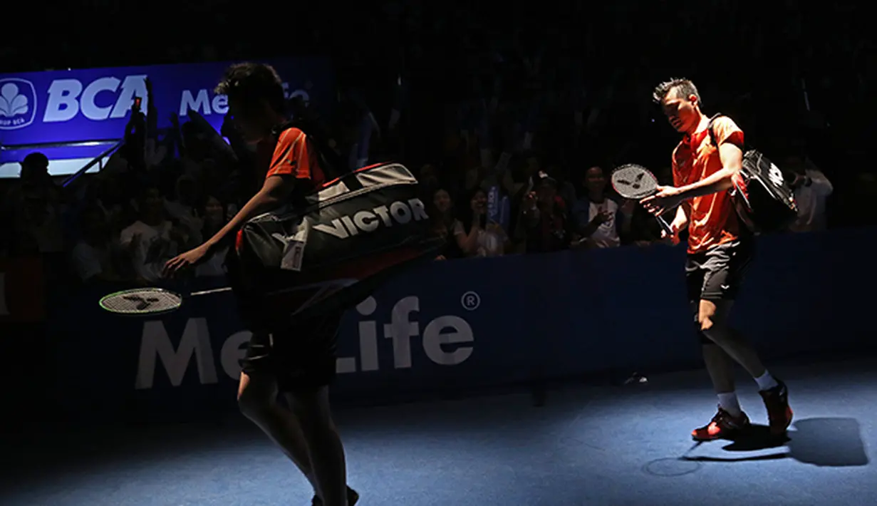 Tontowi Ahmad/Liliyana Natsir memasuki arena pertandingan BCA Indonesia Open 2015. (Peksi Cahyo/Bola.com)