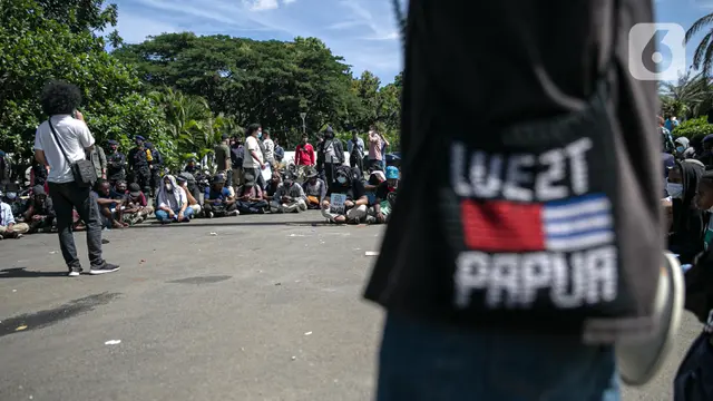 FOTO: Aliansi Mahasiswa Papua Gelar Aksi di Kawasan Patung Kuda