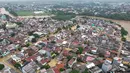 Foto selebaran yang diambil dan dirilis pada Selasa 4 Maret 2025 oleh Badan Nasional Penanggulangan Bencana (BNPB) ini menunjukkan gedung-gedung yang terendam banjir di Bekasi, Jawa Barat. (Foto oleh Handout/Badan Nasional Penanggulangan Bencana/AFP)