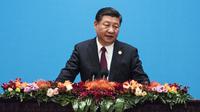 Xi Jinping adalah Presiden China, namanya ditulis dalam konstitusi Partai Komunis sehingga menguatkannya sebagai pemimpin negara paling berkuasa dalam beberapa dekade terakhir. (AFP Photo/Pool/Fred Dufour)