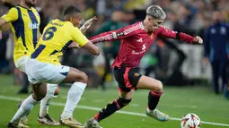 Pertandingan kedua tim berlangsung sengit dan ketat. Laga pun berakhir imbang 1-1. (AP Photo/Francisco Seco)