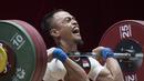 Lifter Indonesia, Suwoto Wijoyo, saat berlaga pada Asian Games di JIExpo, Jakarta, Senin, (20/8/2018). Suwoto Wijoyo berhasil menyumbang medali perunggu angkat besi putra kelas 56kg. (Bola.com/Vitalis Yogi Trisna)